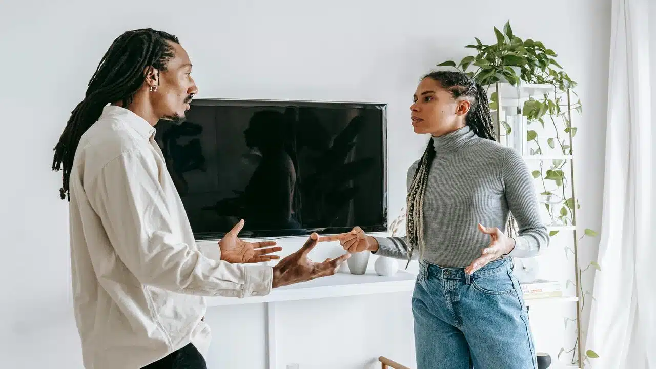 A couple arguing in the living room