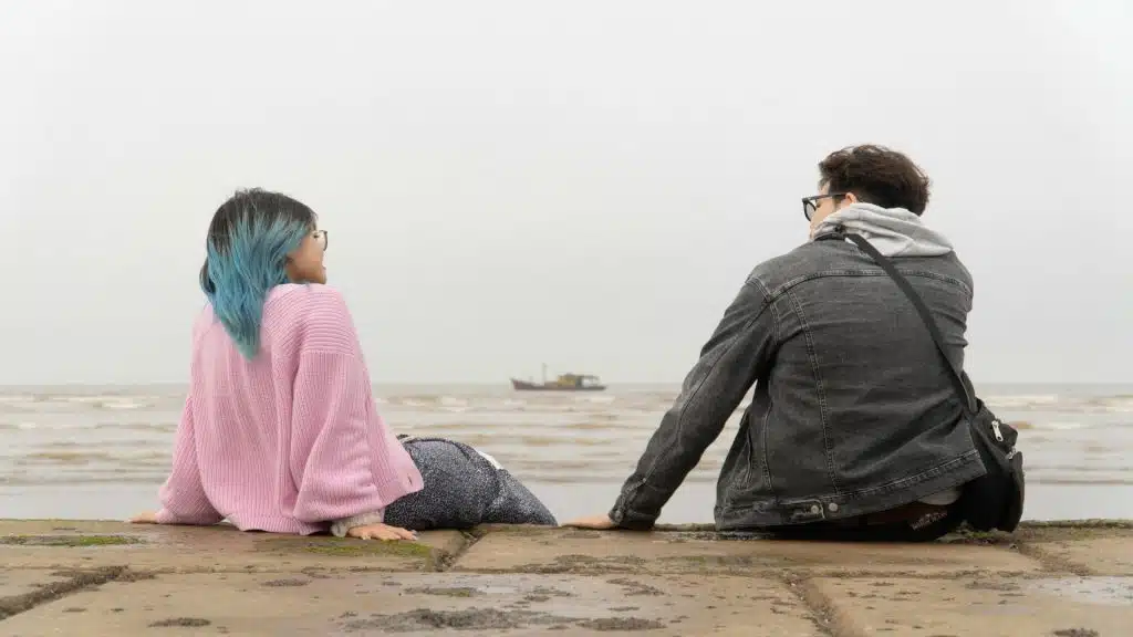 couple sitting together with slight distance