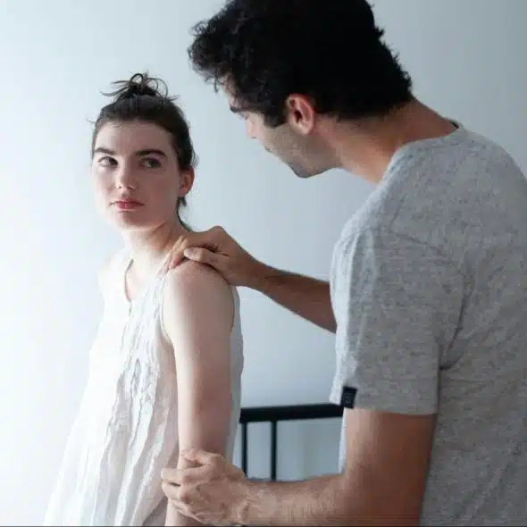 A man talking to a woman