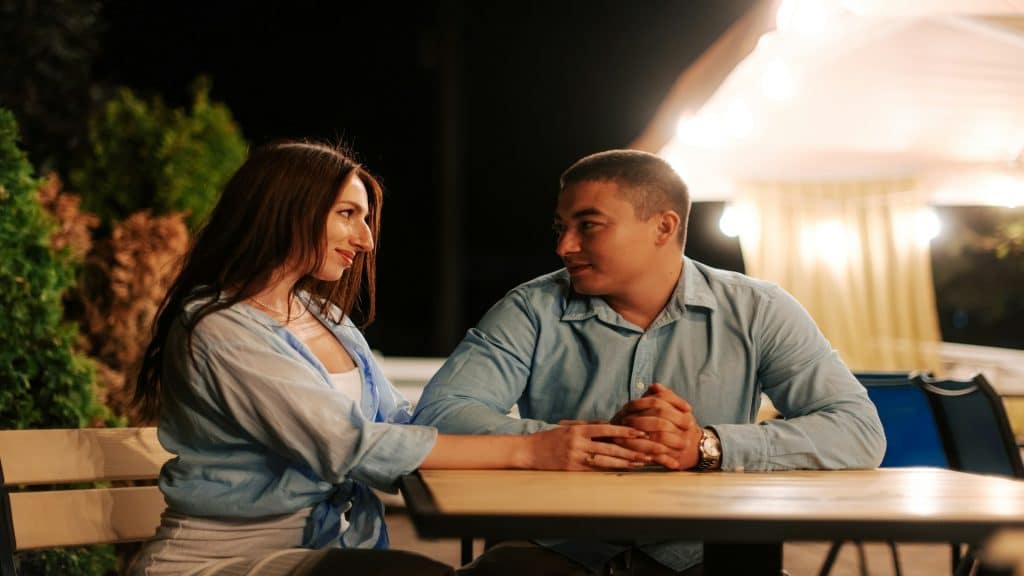 couple talking calmly at table