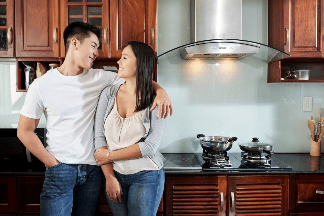 Young happy couple in the kitchen