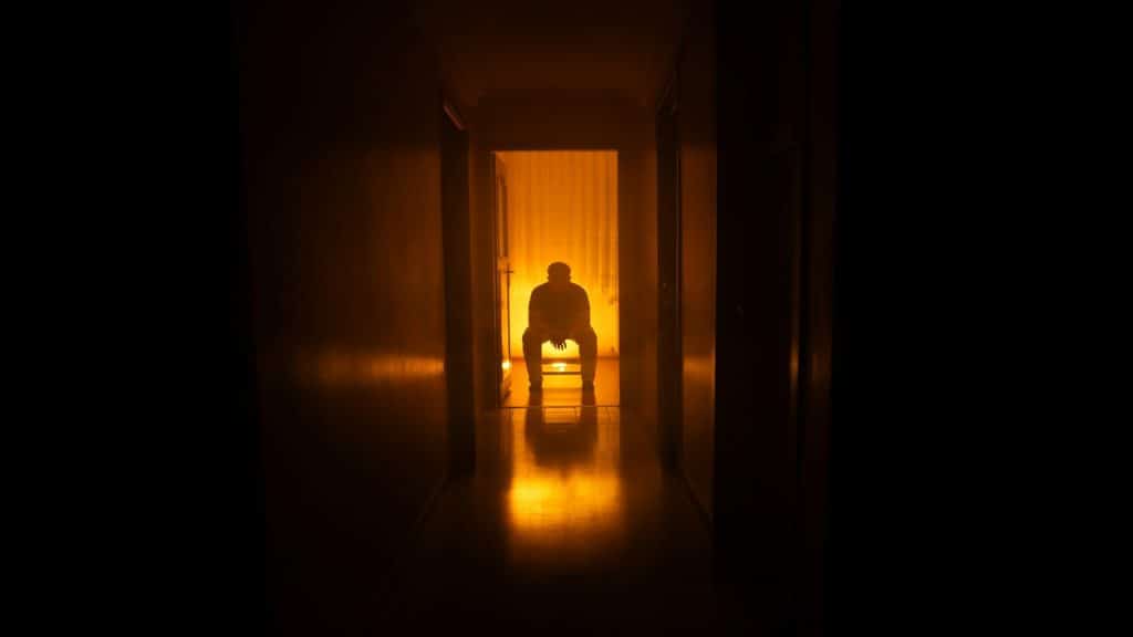 person sitting alone in quiet room