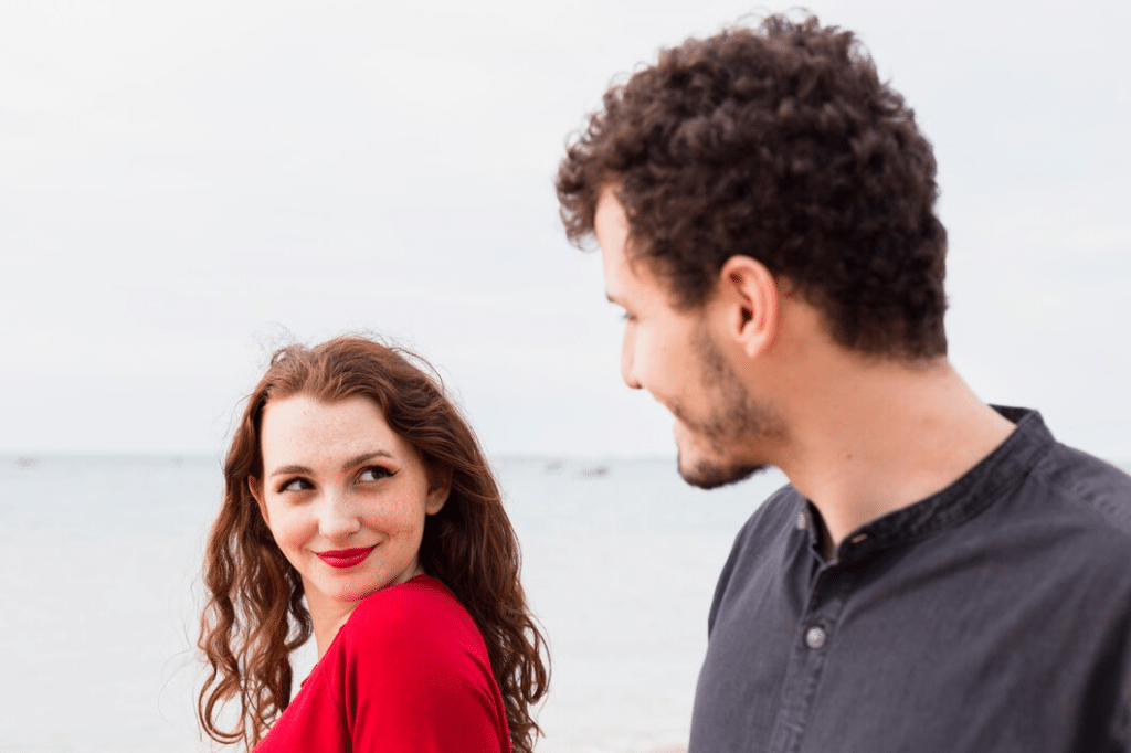 Happy woman with a man on the seashore