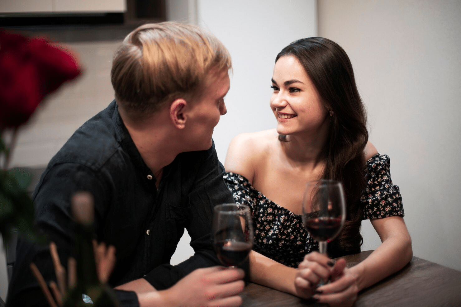 A man and woman smiling at each other