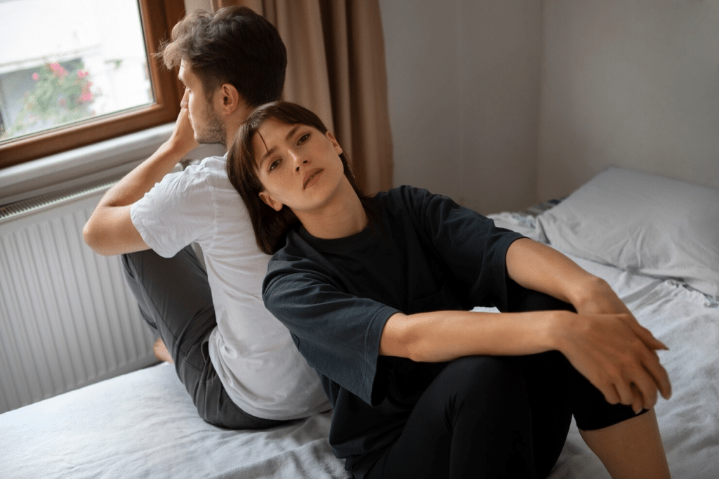A woman leaning on man’s back