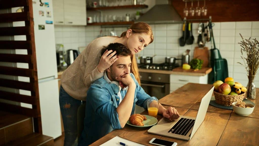 A woman comforting a man