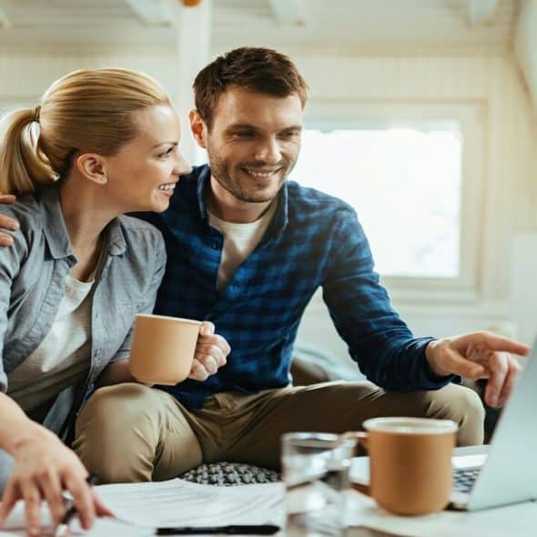 A couple studying their finances together