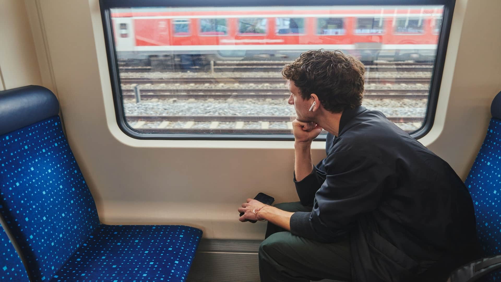 man sitting alone looking frustrated