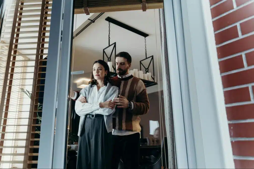 A man behind a woman