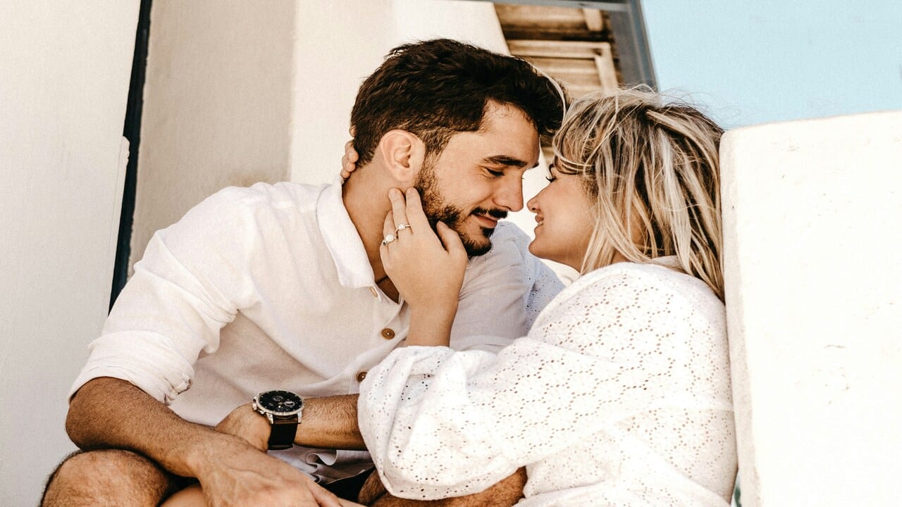 A couple smiling at each other