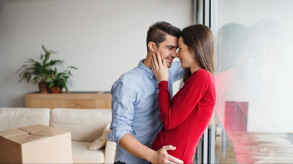 A man and woman facing each other
