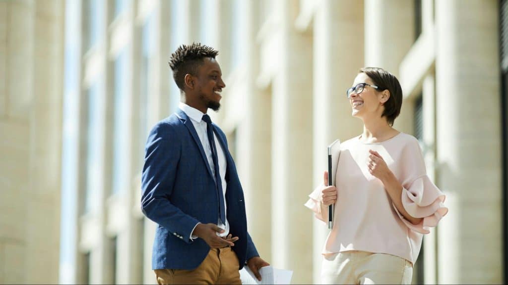 A man and woman smiling at each other