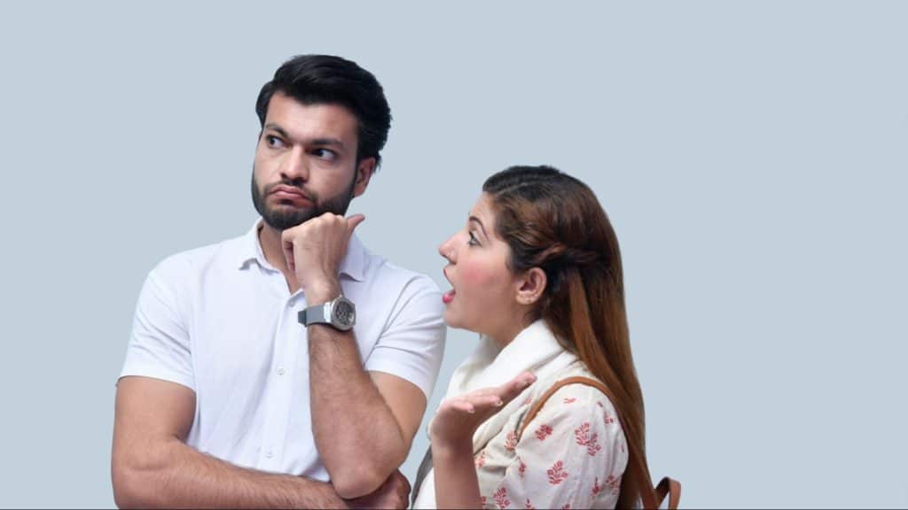 A man being moody around a woman 