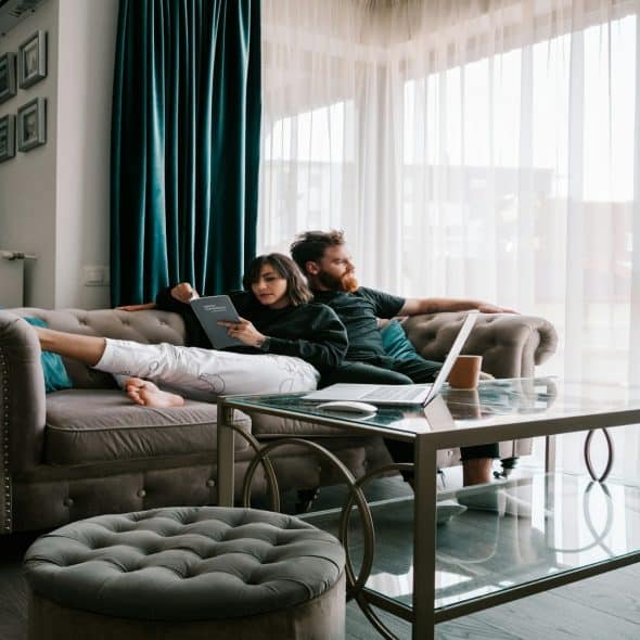 couple sitting quietly together on couch