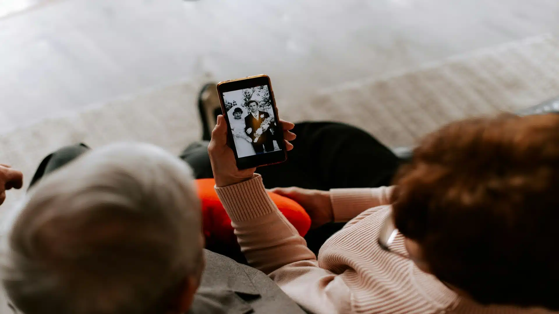 couple looking at old photos