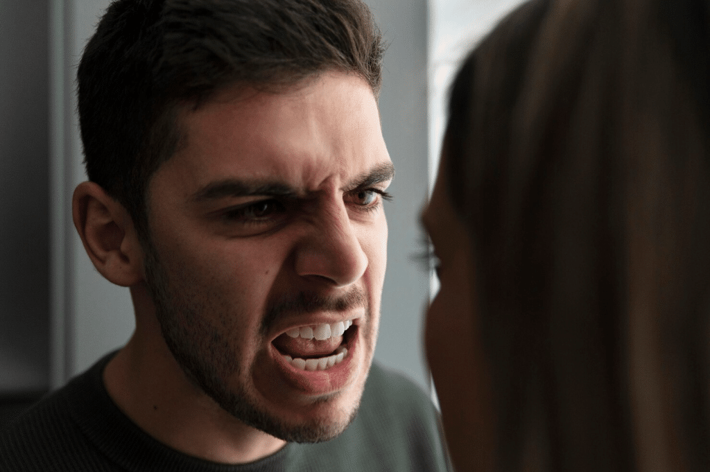 A man shouting at the woman
