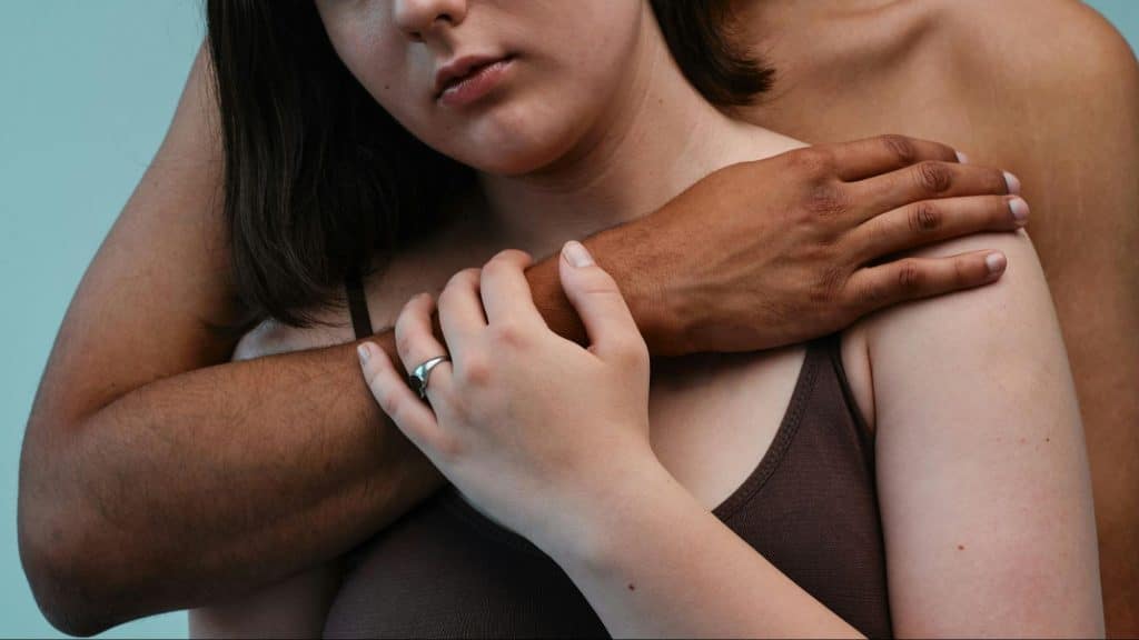 A man embracing woman