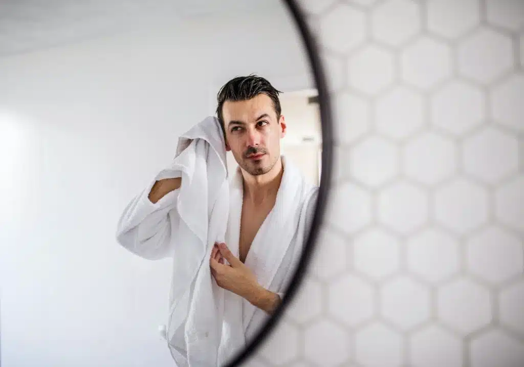 man getting ready mirror morning