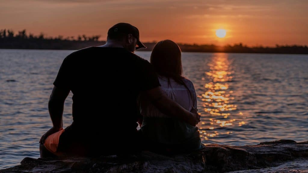 couple watching sunset together