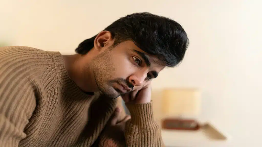 man sitting thoughtfully