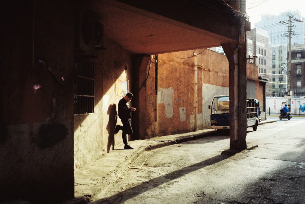 man walking alone city
