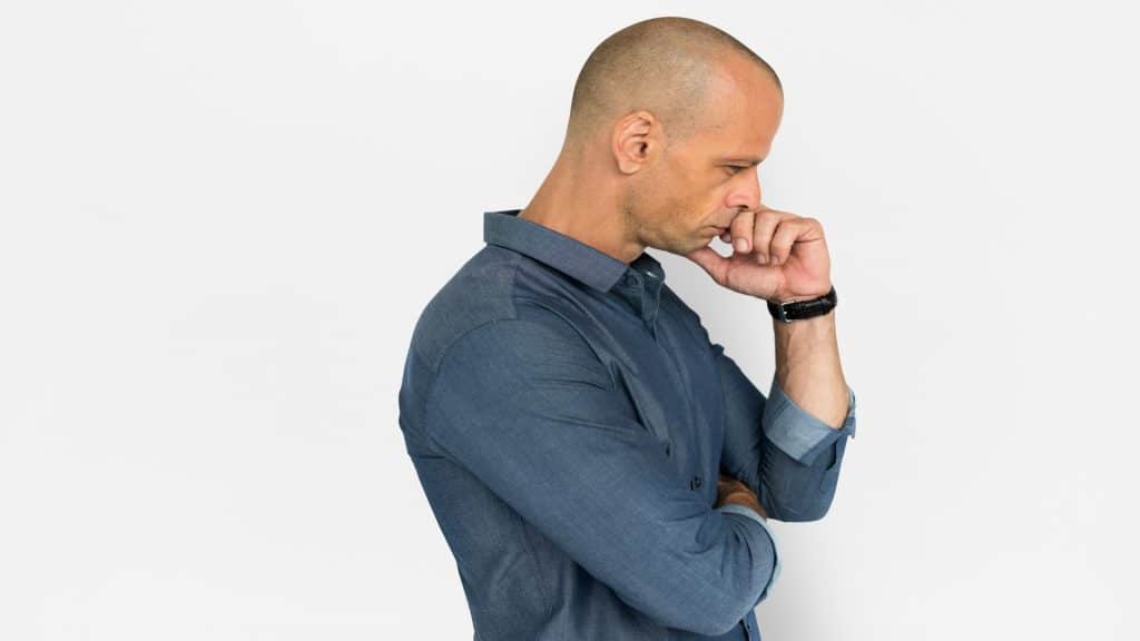 man doing something thoughtful unnoticed
