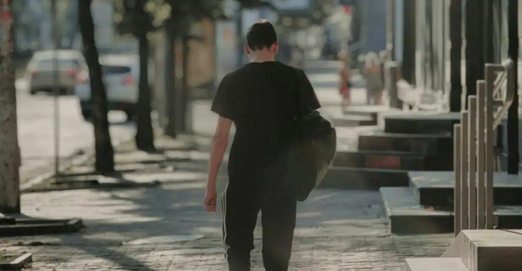 man walking alone city