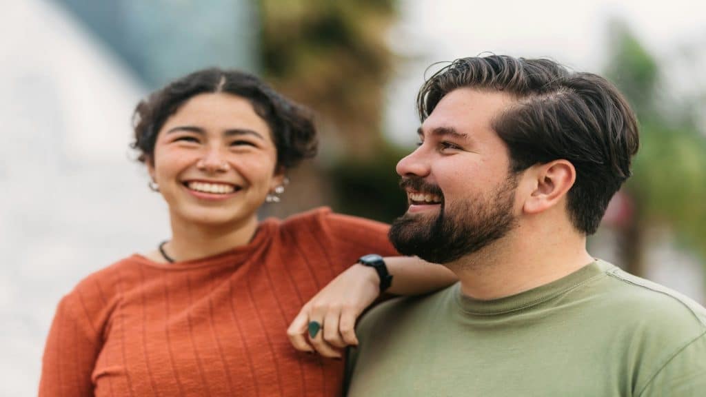 couple smiling naturally together