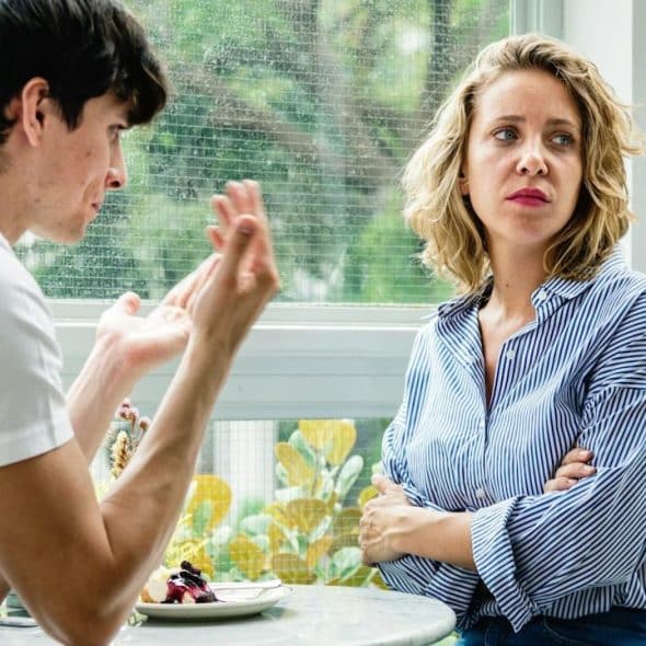 A man talking to his wife, who is ignoring him.