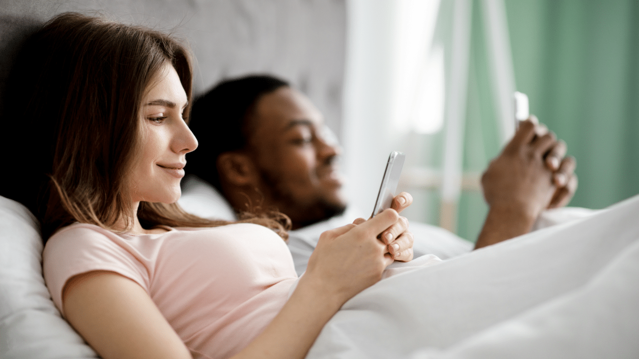 A couple busy with their phones