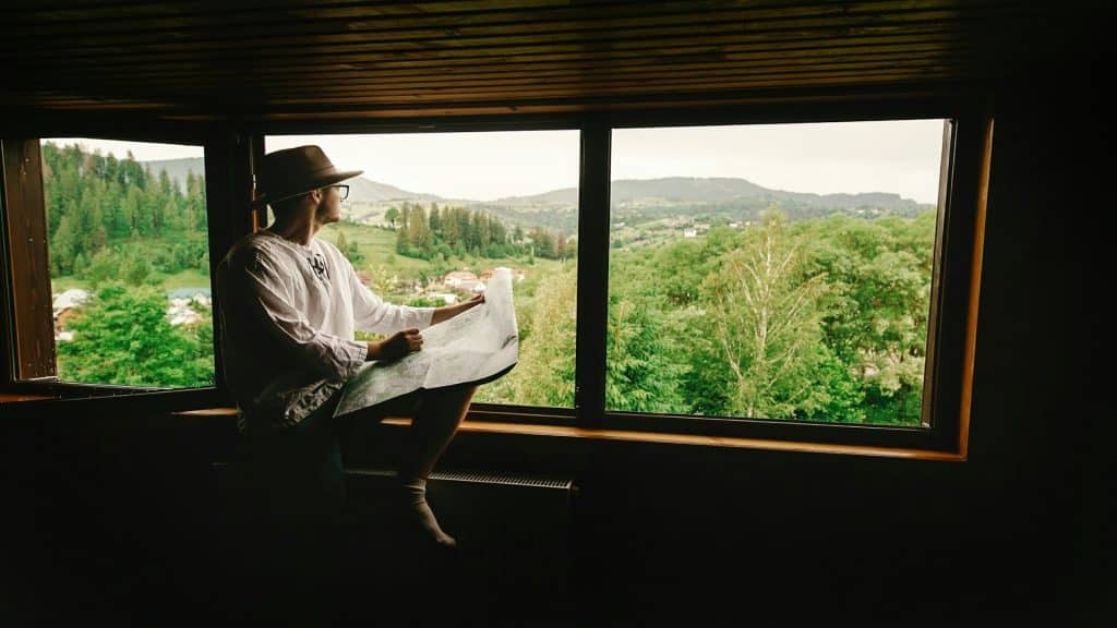 man sitting quietly by window