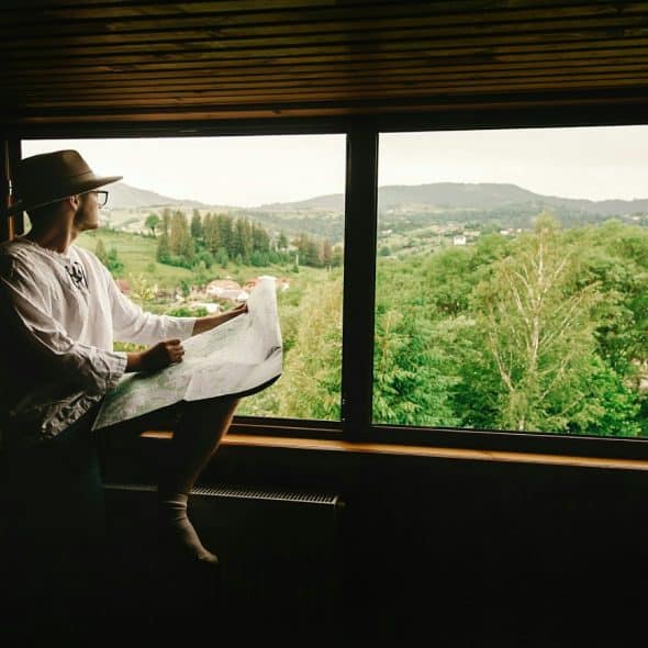 man sitting quietly by window