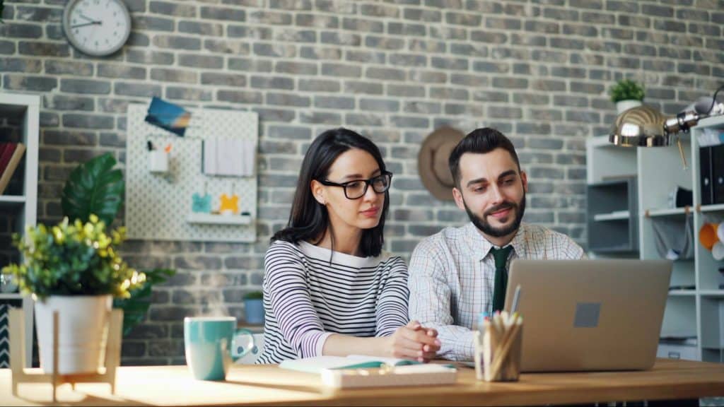 Woman supporting a man