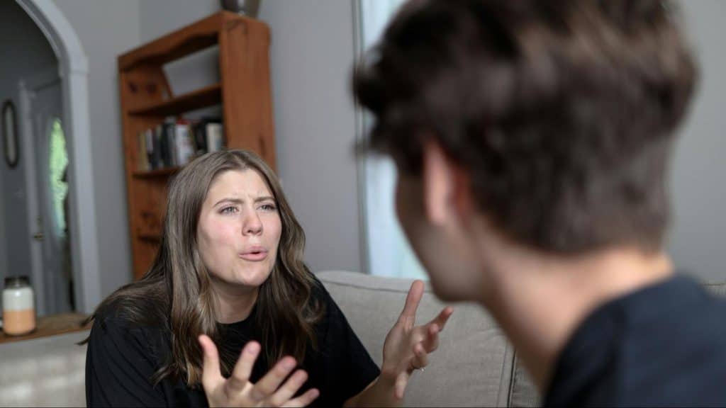 Woman trying to speak with a man