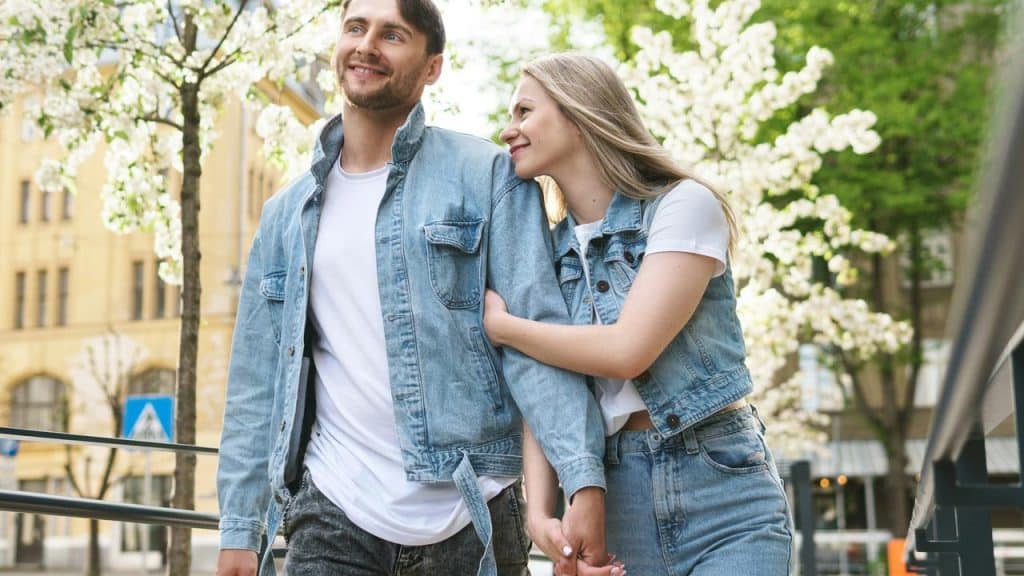 A couple walking arm in arm