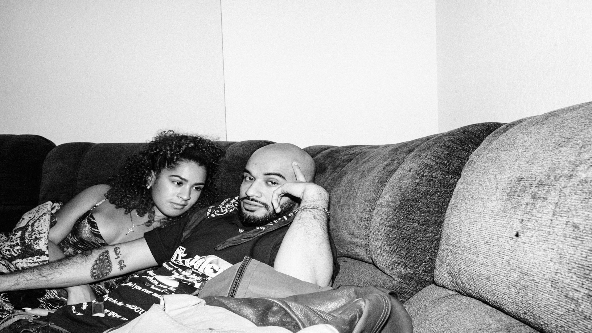 couple sitting closely on couch