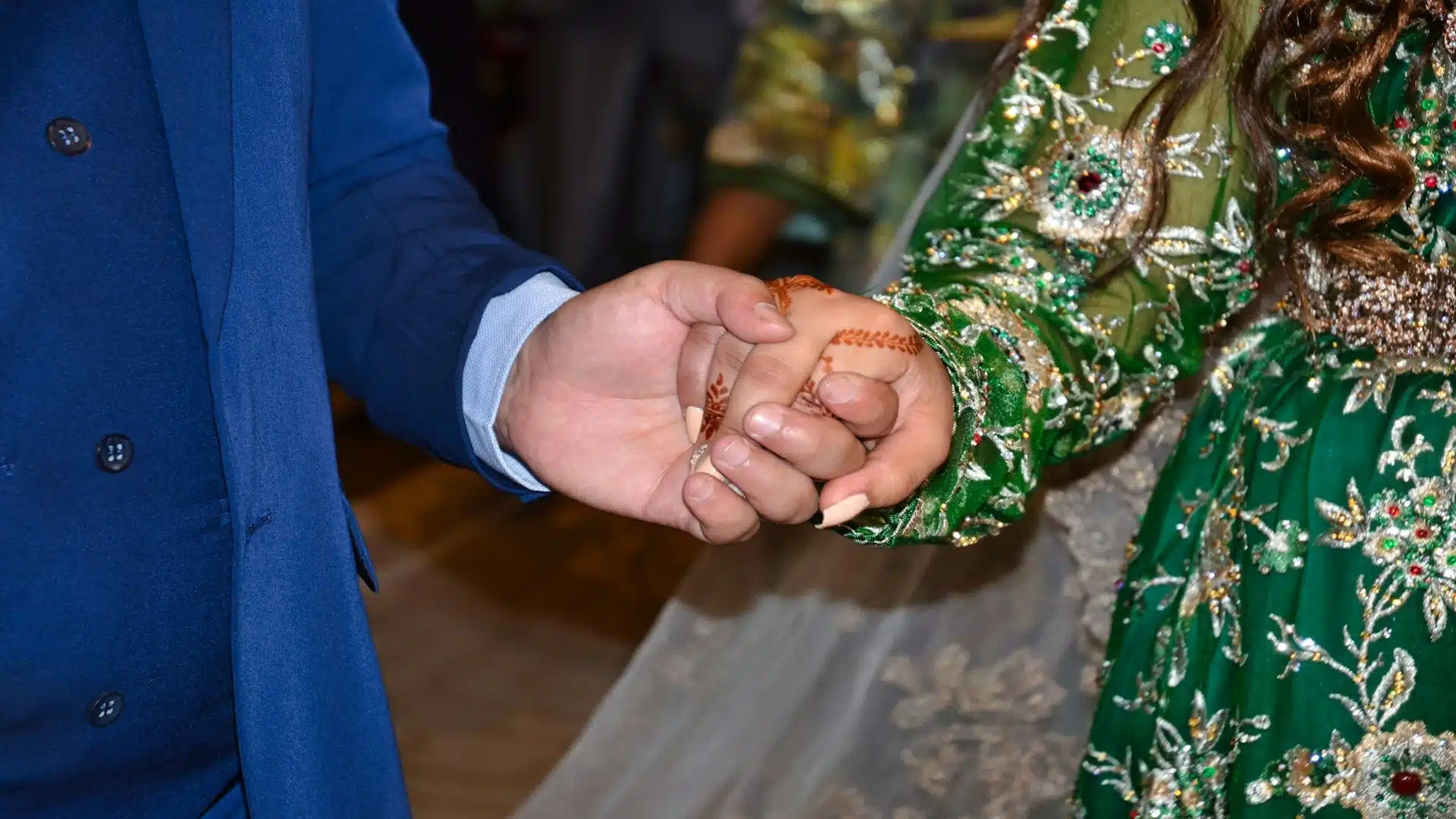 couple holding hands during ceremony