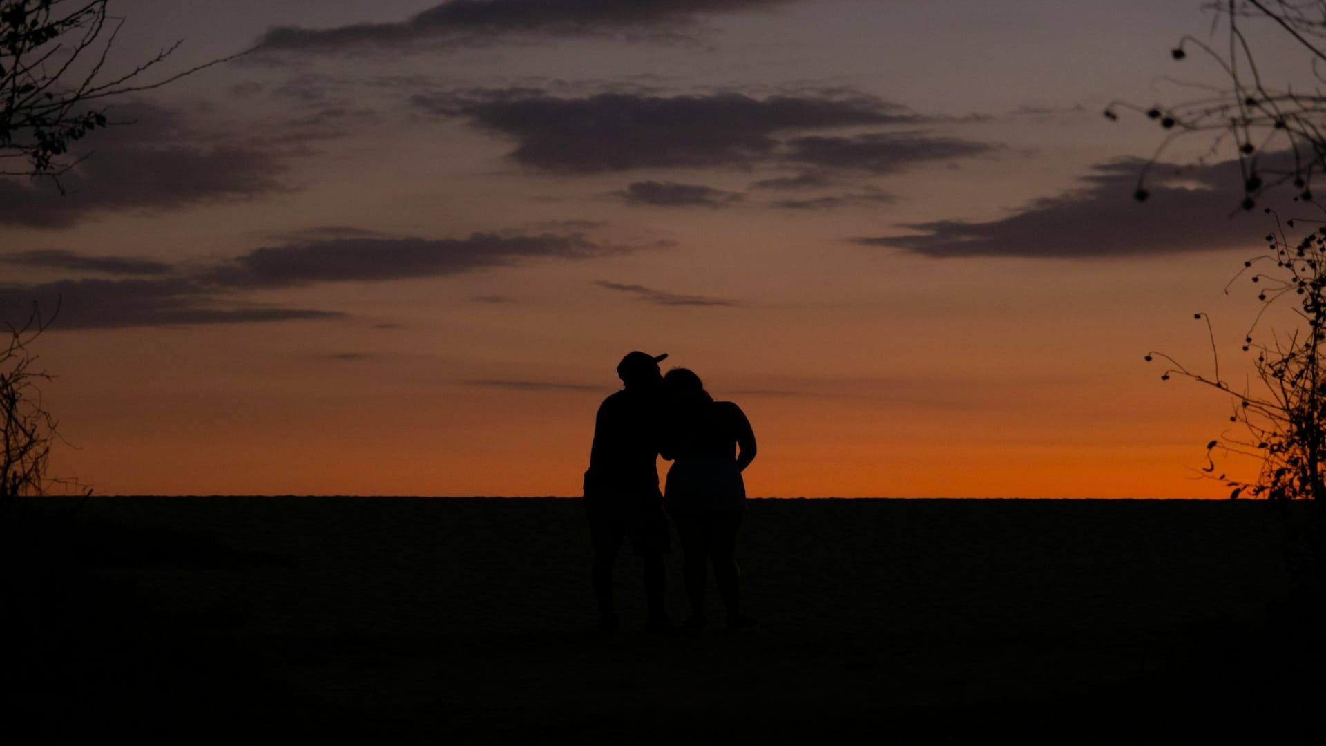 couple watching sunset together