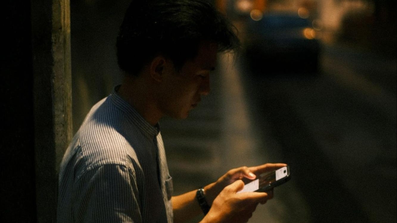 man looking at phone
