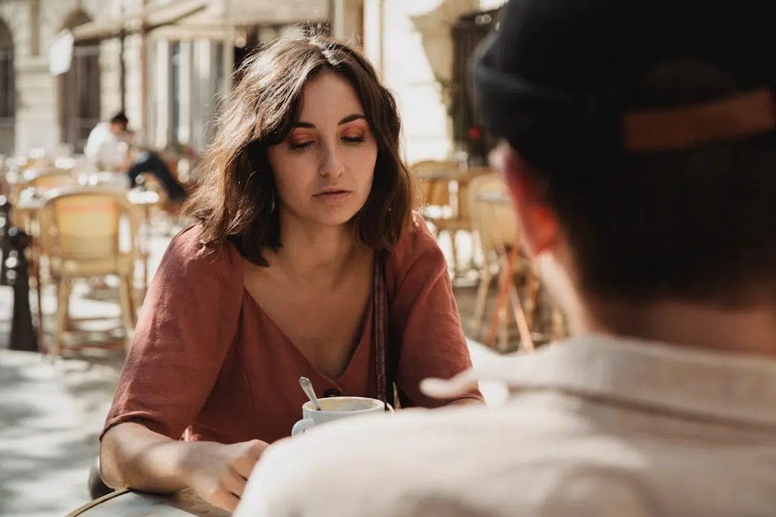 A couple talking in a cafe