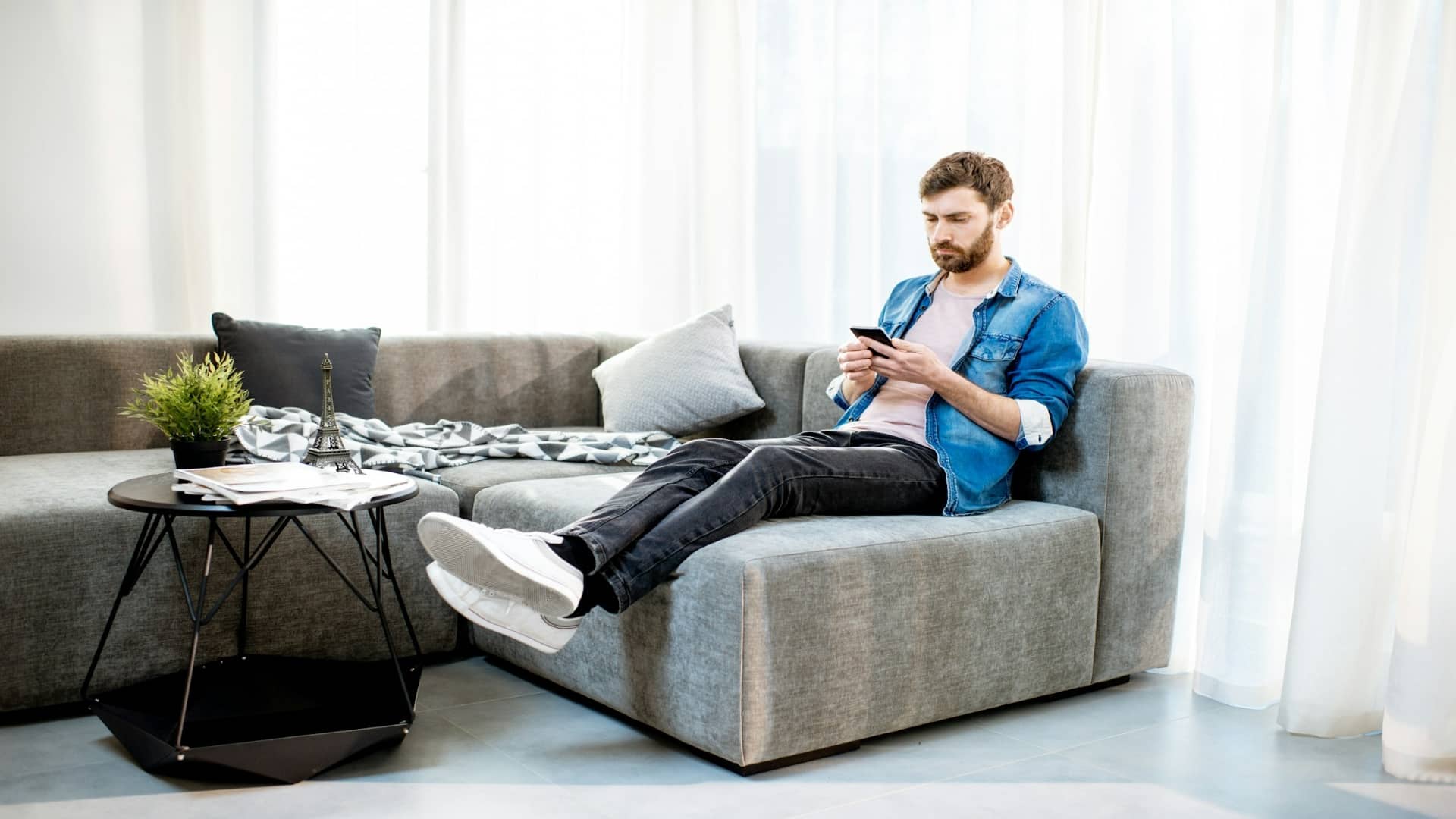 man looking at apartment listings