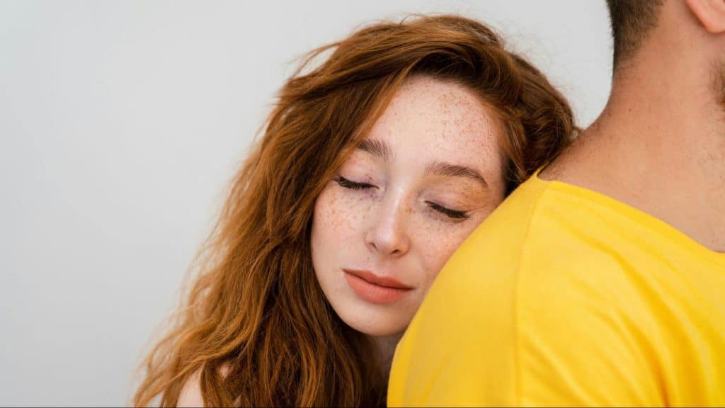 Woman hugging a mysterious person