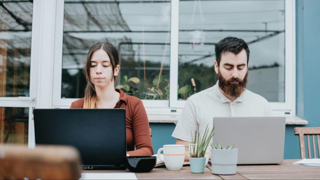 A man and woman busy working
