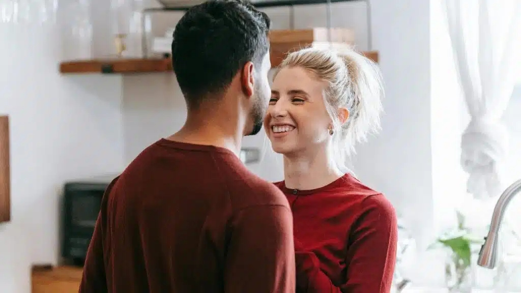 A couple smiling warmly at each other