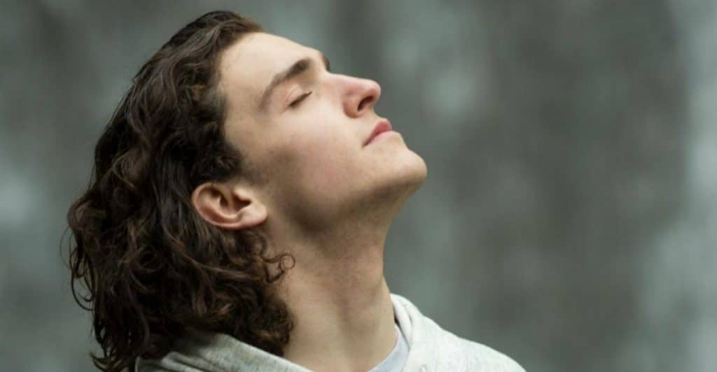 man breathing calmly
