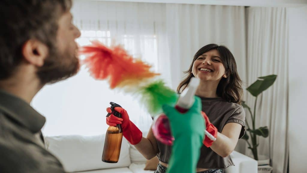 couple cleaning home together