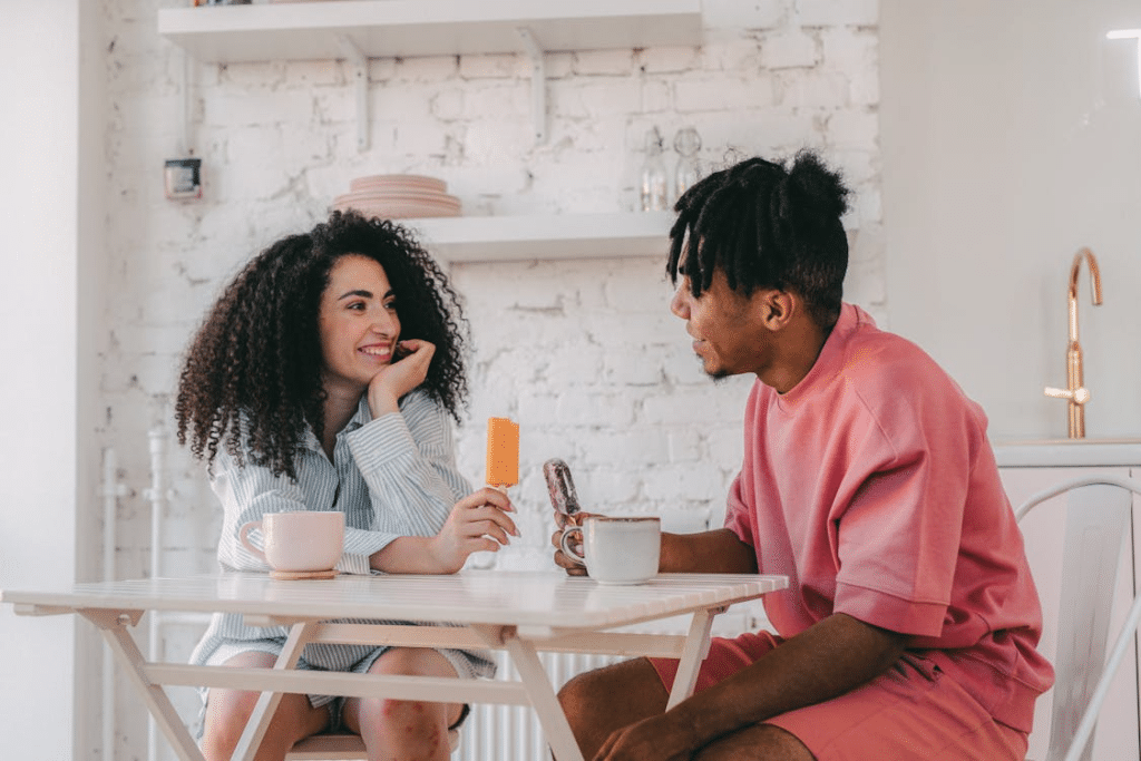 A Romantic Couple Sitting on Chairs having a conversation
