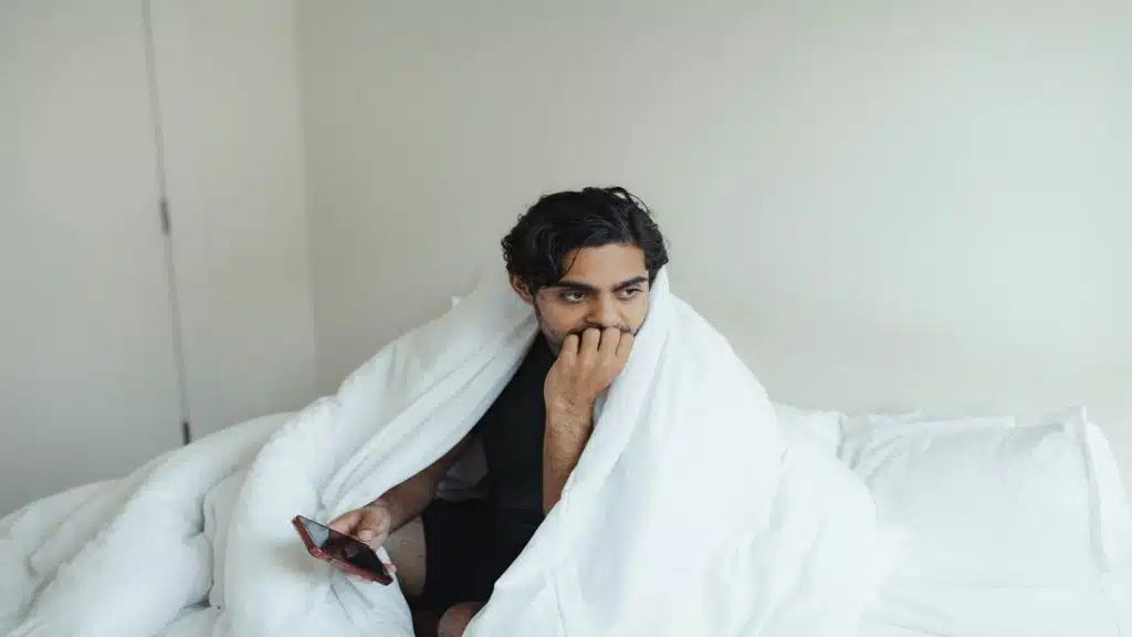 man looking uncomfortable