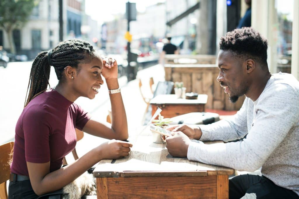 couple laughing cafe