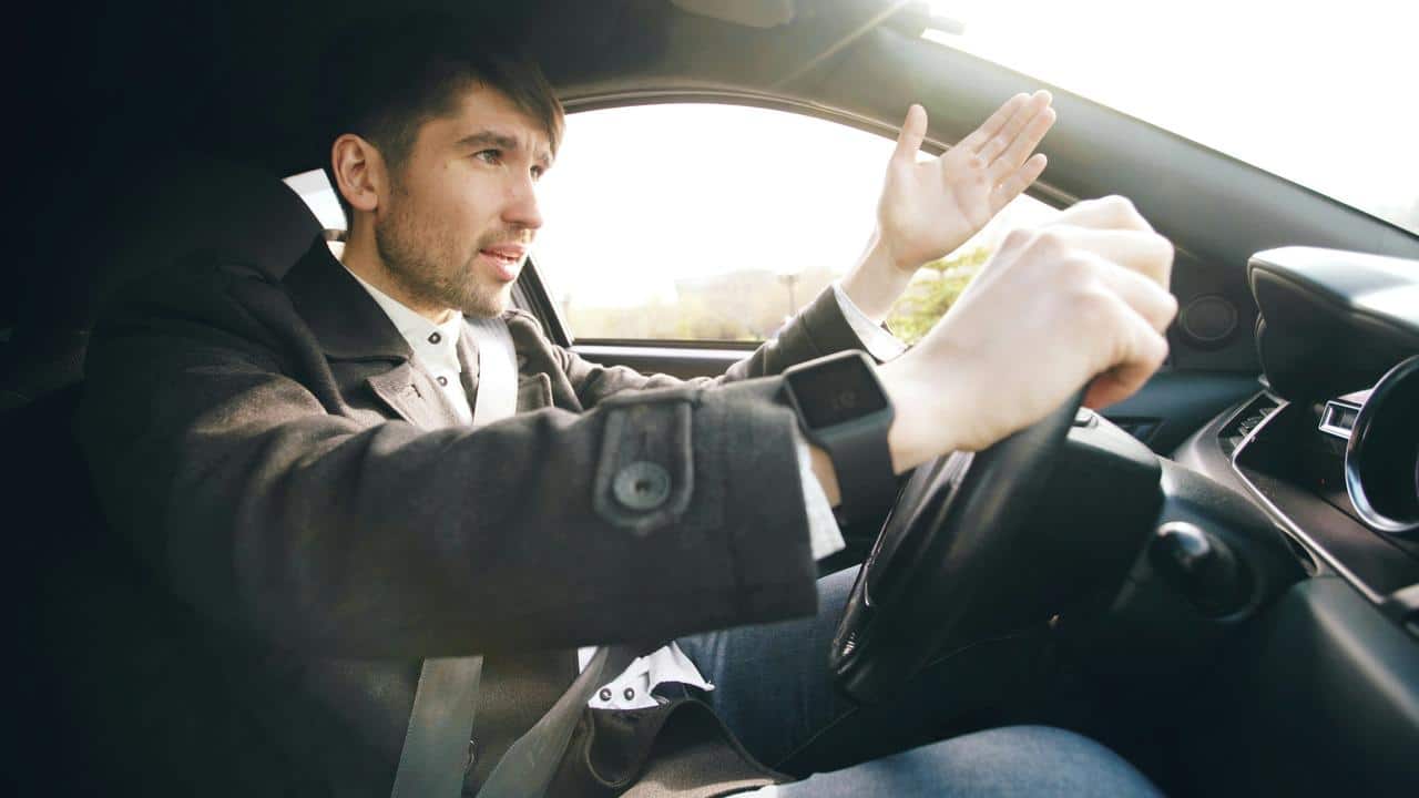 A man driving a car